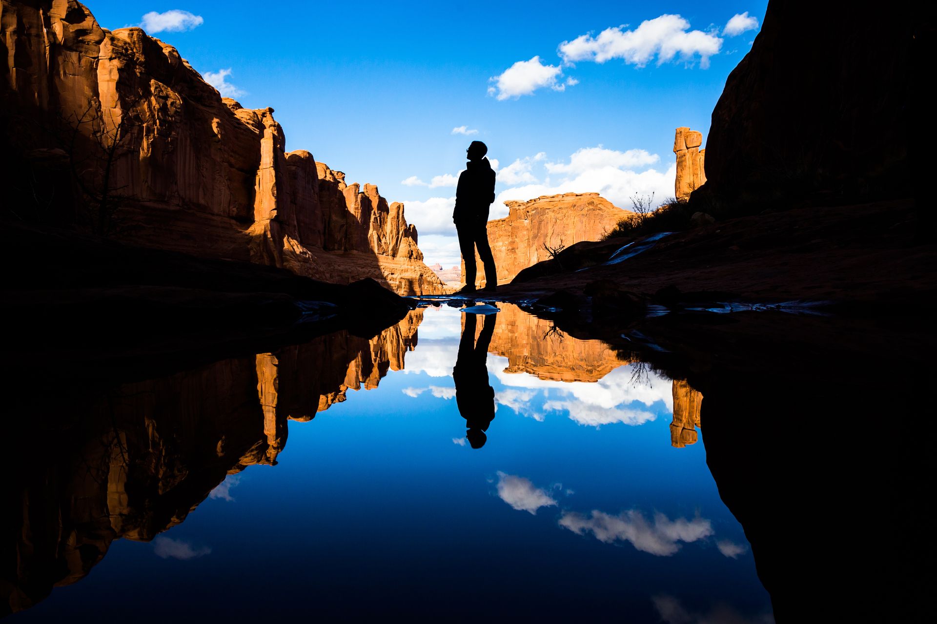 Canyon silhouette reflected in still water